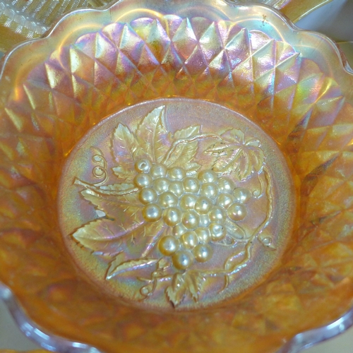 856 - Eleven items of marigold carnival glass including Fenton flowering dill vase, Fenton peacock and gra... 