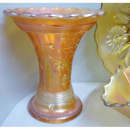 856 - Eleven items of marigold carnival glass including Fenton flowering dill vase, Fenton peacock and gra... 