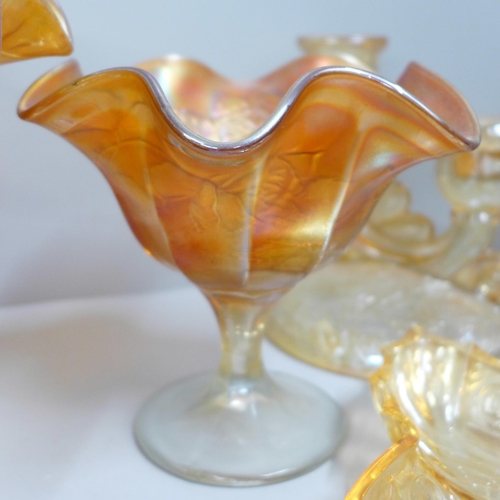 857 - Ten items of marigold carnival glass, butterfly dish, pedestal bowl, kokomo rose bowl, etc. **PLEASE... 