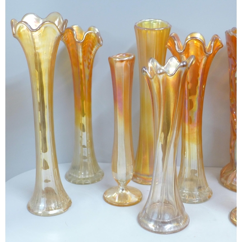 858 - A collection of thirteen carnival glass vases in marigold **PLEASE NOTE THIS LOT IS NOT ELIGIBLE FOR... 