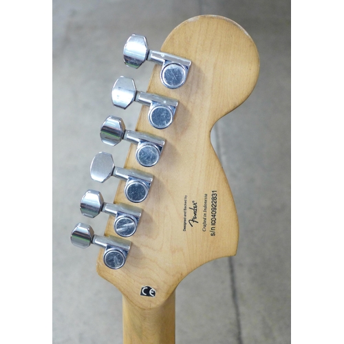 872 - A left handed Fender Squier Strat guitar and stand