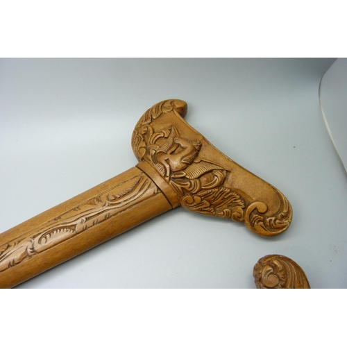 883 - A Malayan kris with carved scabbard