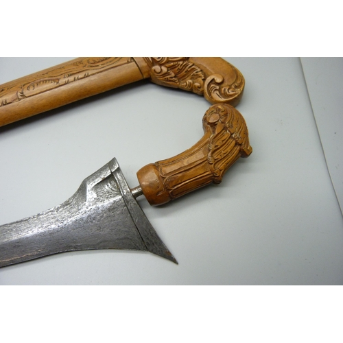 883 - A Malayan kris with carved scabbard