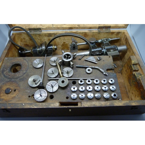 888 - A watchmaker's lathe, 8mm with collets and step chucks, cased