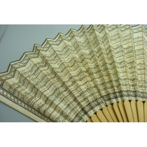 891 - A late 18th/early 19th century paper-leaf fan decorated with 'Twelve of the most famous Country Danc... 