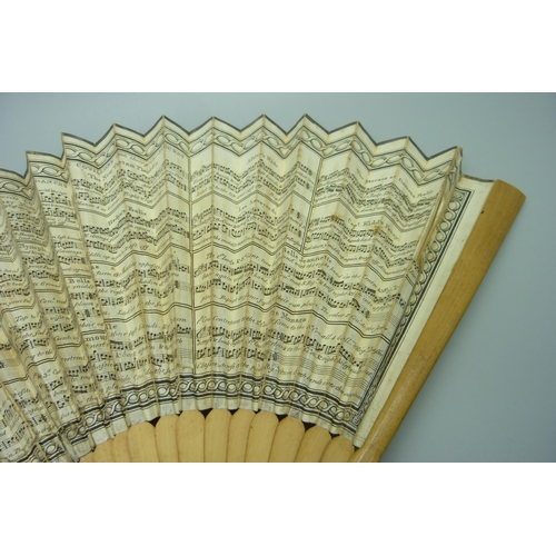 891 - A late 18th/early 19th century paper-leaf fan decorated with 'Twelve of the most famous Country Danc... 