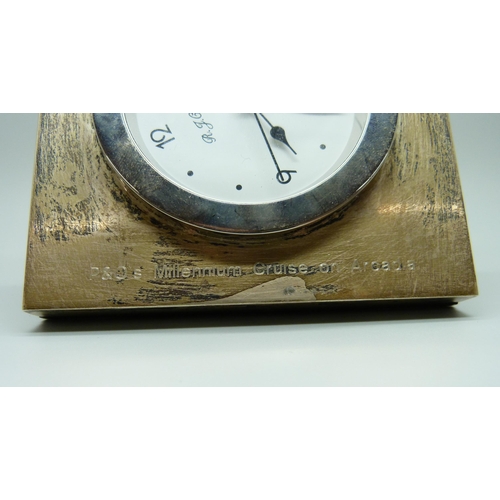 894 - A silver fronted P & O Millennium clock, 10cm