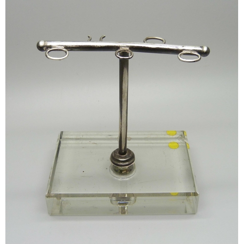 897 - A silver manicure stand on a glass base, Birmingham 1934