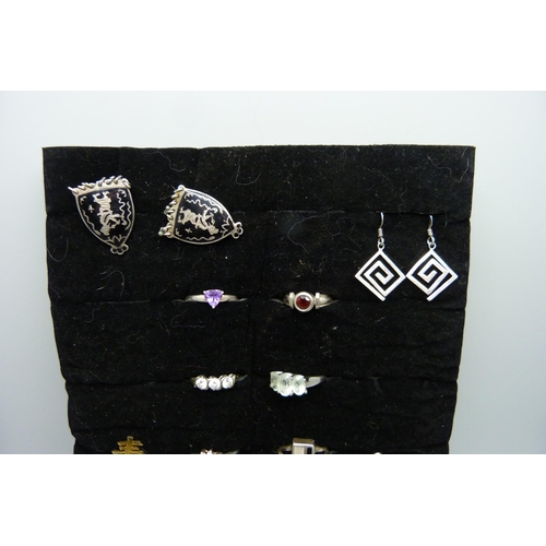 903 - Eight silver rings, a pair of silver earrings, two pairs of white metal earrings, and a pair of silv... 