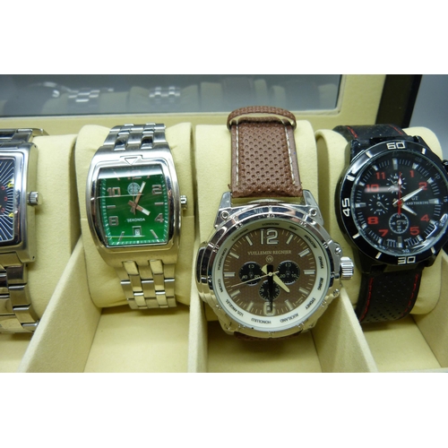 933 - Six wristwatches in a display case including Sekonda and Aviatime