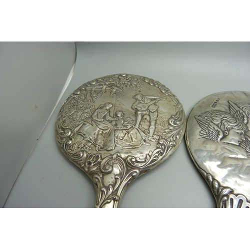 938 - Silver backed brushes and mirrors including two embossed with Reynolds Angels, one brush silver plat... 