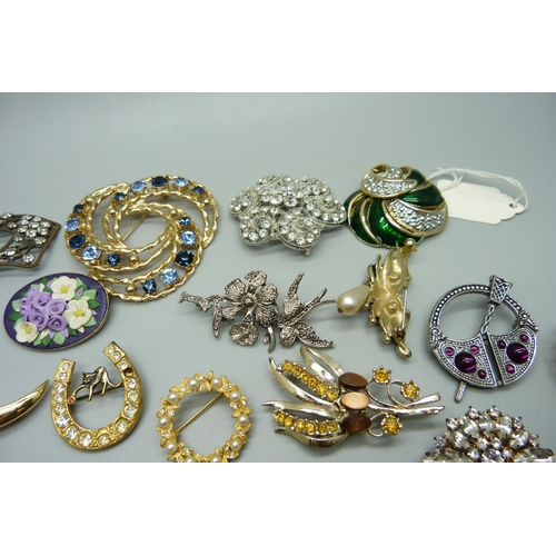 944 - A collection of costume brooches