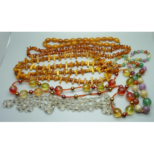 945 - A collection of bead necklaces including amber