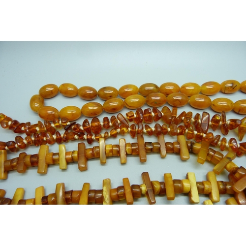 945 - A collection of bead necklaces including amber