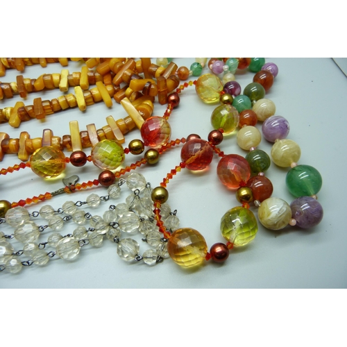 945 - A collection of bead necklaces including amber