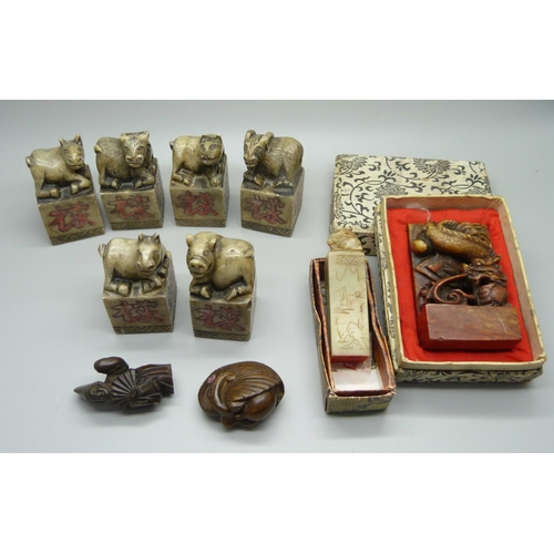 946 - Oriental carved stone seals and two netsukes