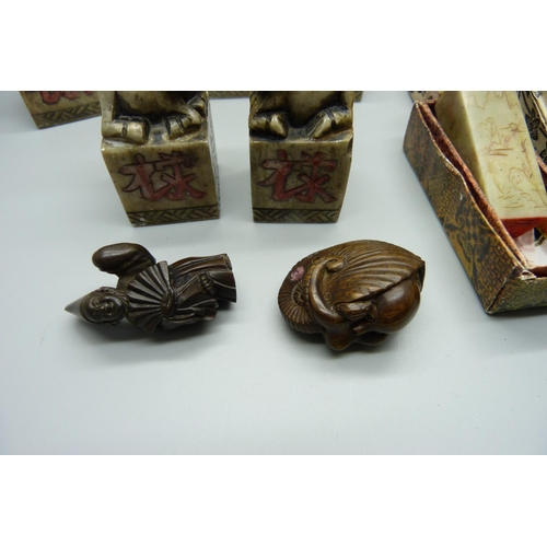 946 - Oriental carved stone seals and two netsukes