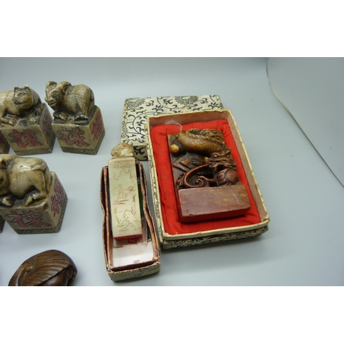 946 - Oriental carved stone seals and two netsukes