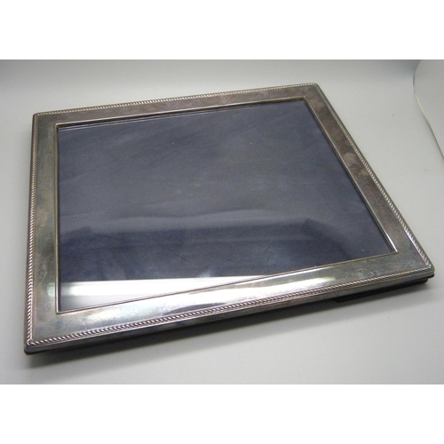 951 - A silver photograph frame, 30cm x 25cm approximate