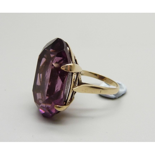 958 - A 9ct gold and large purple stone solitaire ring, stone approx. 2.5cm x 1.8cm, 9.2g, O