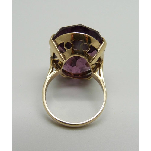 958 - A 9ct gold and large purple stone solitaire ring, stone approx. 2.5cm x 1.8cm, 9.2g, O