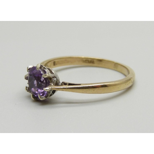 963 - A 9ct gold and amethyst solitaire ring, 1.8g, M