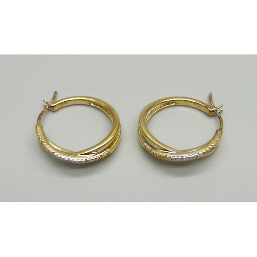 967 - A pair of silver gilt hoop earrings, each set with 5 small diamonds