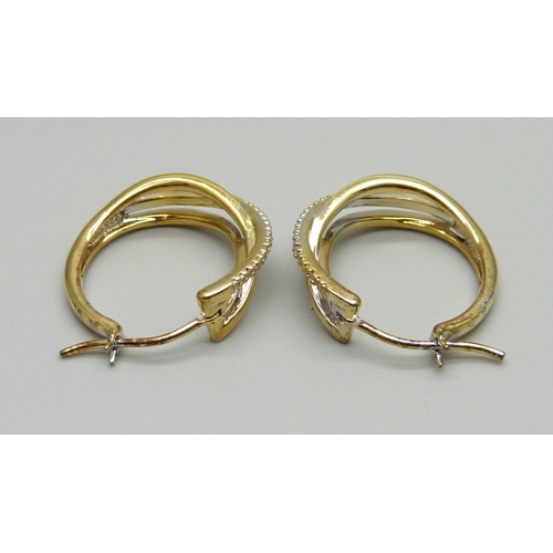 967 - A pair of silver gilt hoop earrings, each set with 5 small diamonds