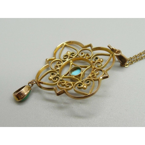 969 - A 9ct gold and turquoise pendant on a 9ct gold chain, 3.3g, 4cm pendant length