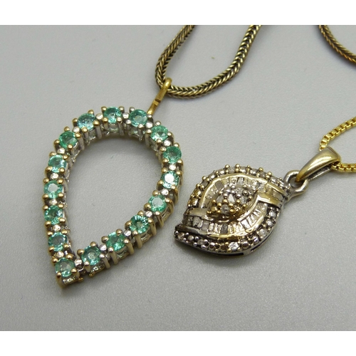 970 - A silver gilt and diamond pendant on chain, and a green stone silver gilt pendant on chain