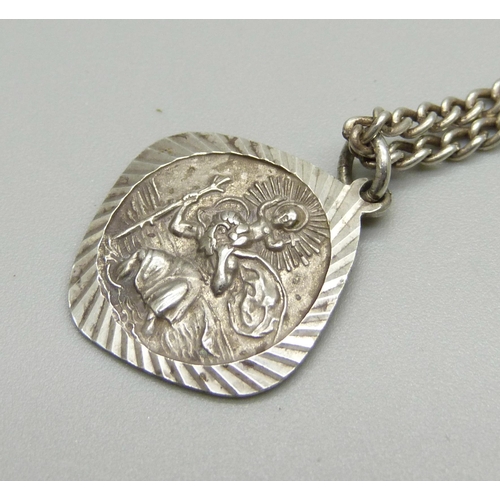 997 - A Georg Jenson silver St. Christopher pendant and chain with decoration on both sides, 11g