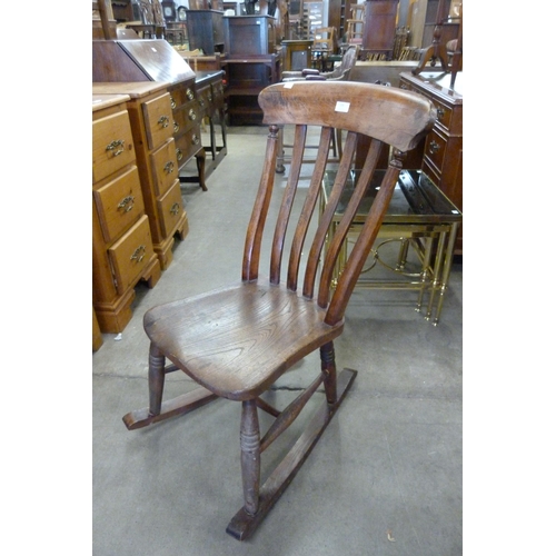 150 - A Victorian elm and beech farmhouse rocking chair