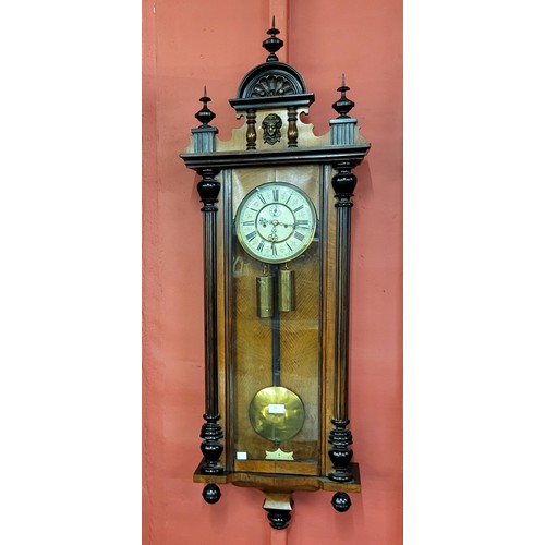 18 - A 19th Century walnut double weight Vienna wall clock