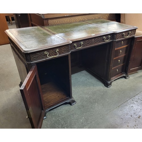 182 - A Victorian Chipendale Revival carved mahogany and green leather topped library desk