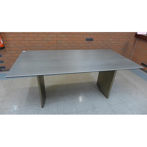 1301 - A grey ceramic topped dining table