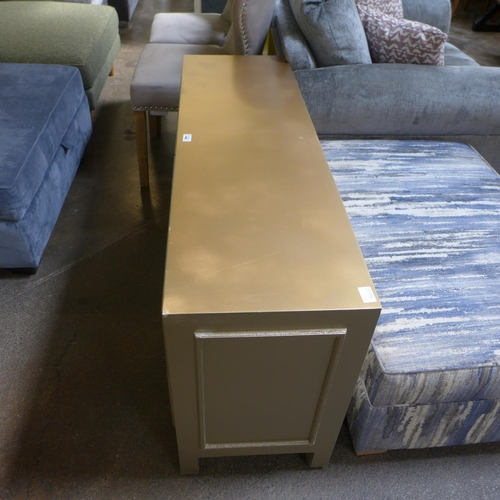 1496 - A gold four drawer sideboard