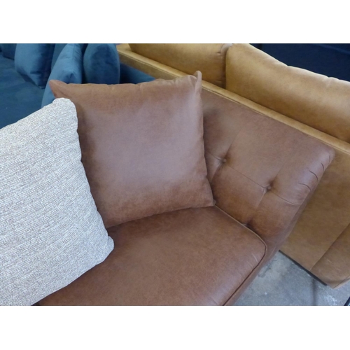 1499 - A dark tan vegan leather upholstered three seater sofa with contrasting scatter back cushion