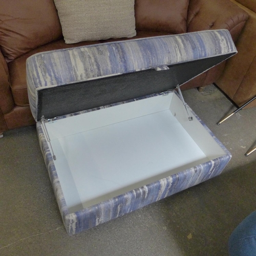 1500 - A blue, white and grey upholstered ottoman footstool