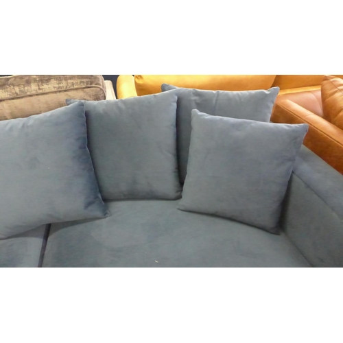 1503 - A blue velvet upholstered scatter back 4.5 seater sofa