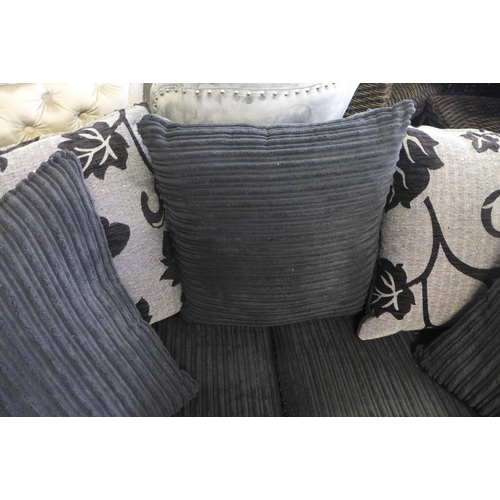 1651 - A charcoal jumbo corduroy and snake skin effect two seater sofa