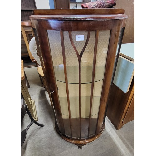 208 - A walnut bow front display cabinet