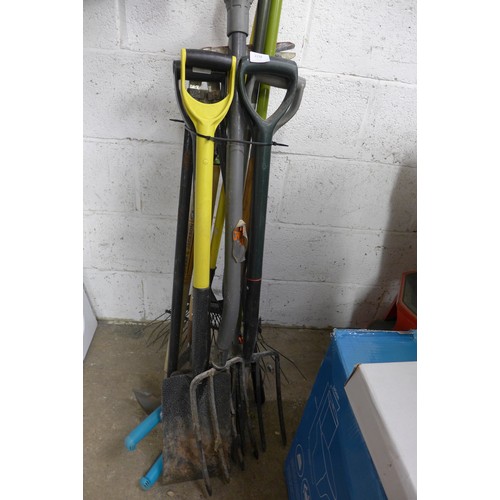 2238 - Bundle of garden tools including spades, forks rakes and more