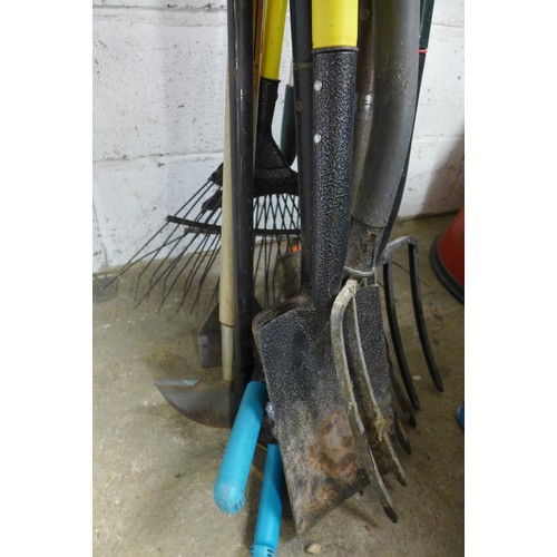 2238 - Bundle of garden tools including spades, forks rakes and more