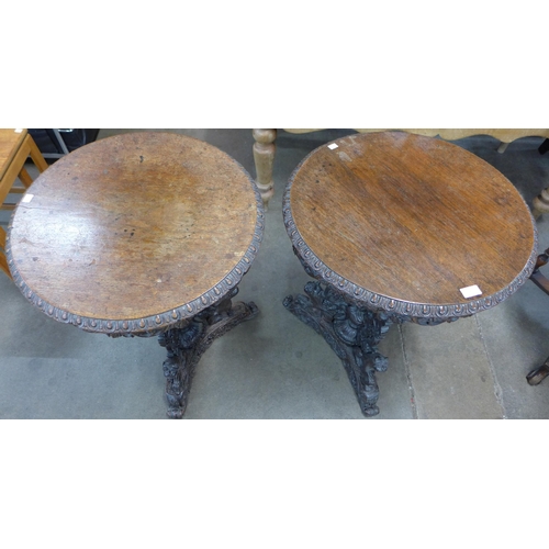 1 - A pair of Burmese carved hardwood circular lamp tables