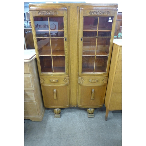 114 - A carved oak four door bookcase