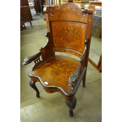 121 - A 19th Century Dutch marquetry inlaid walnut armchair