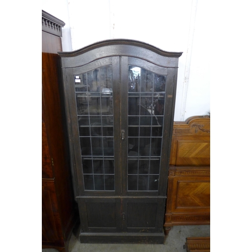 122 - An early 20th Century oak four door bookcase