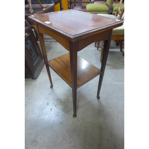 131 - An Edward VII mahogany fold over games table