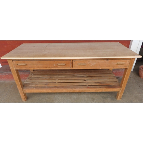 144 - An early 20th Century and later pine and beech two drawer drapers table