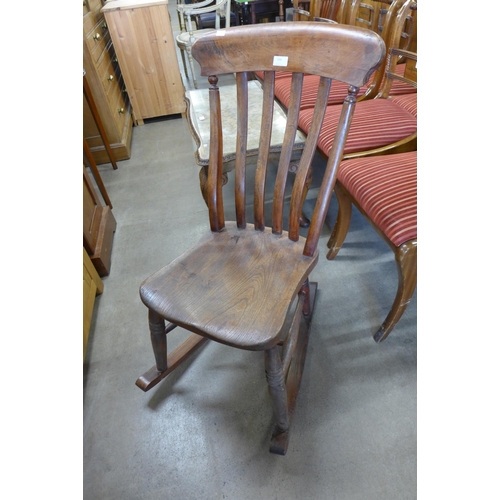 150 - A Victorian elm and beech farmhouse rocking chair